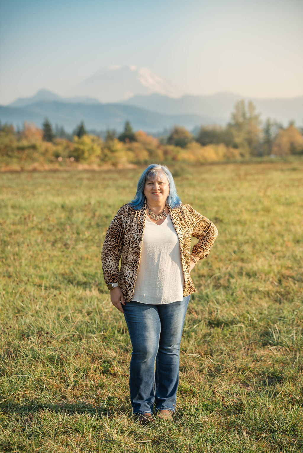 Eva standing in a field representing the charge program